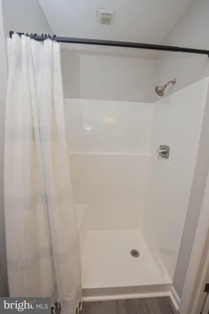 a view of an empty room with a closet