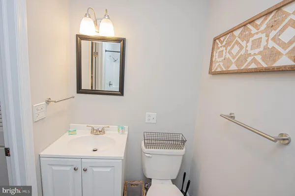 a spacious bedroom with a bed and a flat screen tv