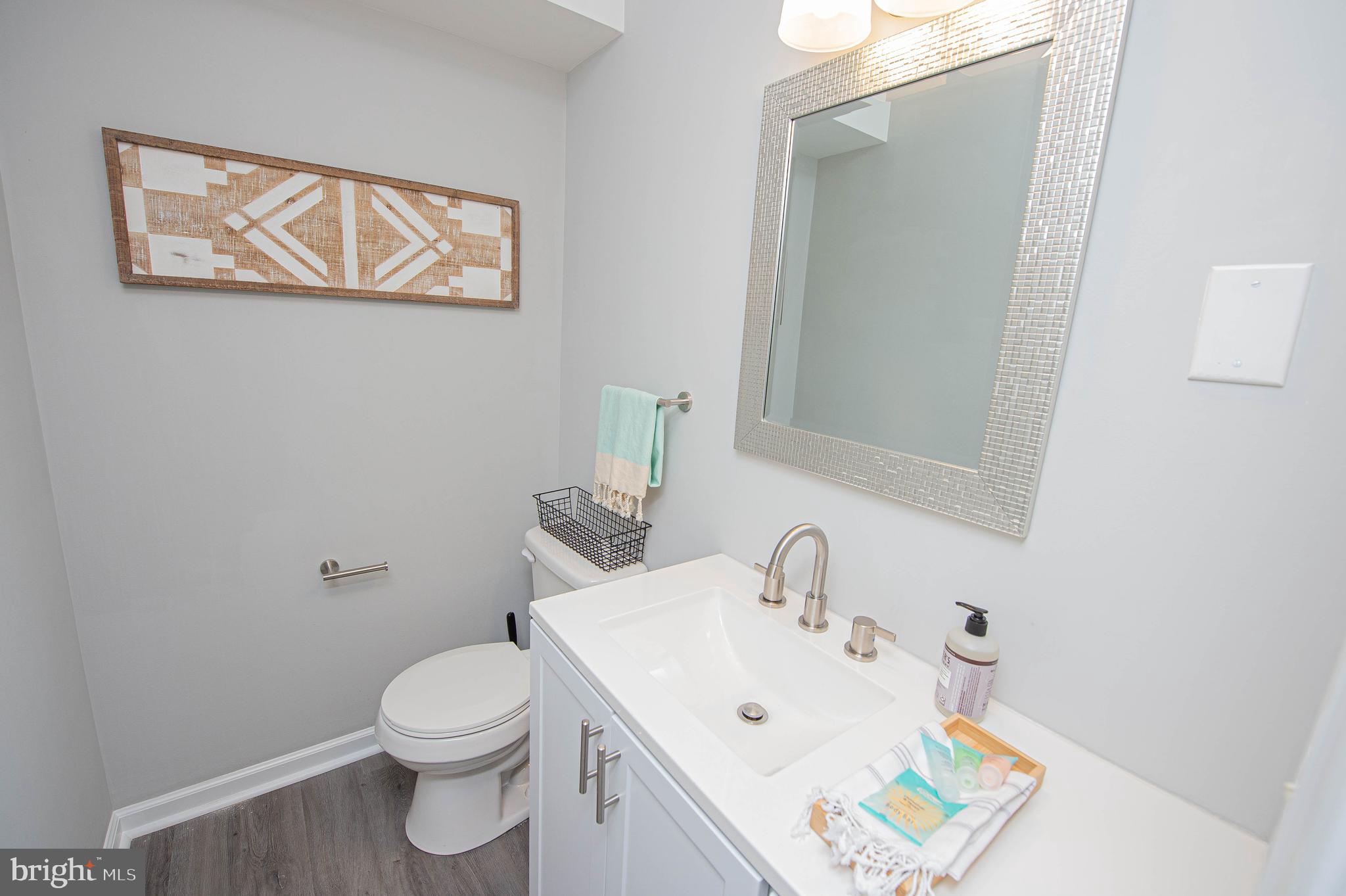 414 Pine Bluff Road Salisbury, MD 21801 - Photo 50 of 91 a white toilet sitting next to a bathroom sink