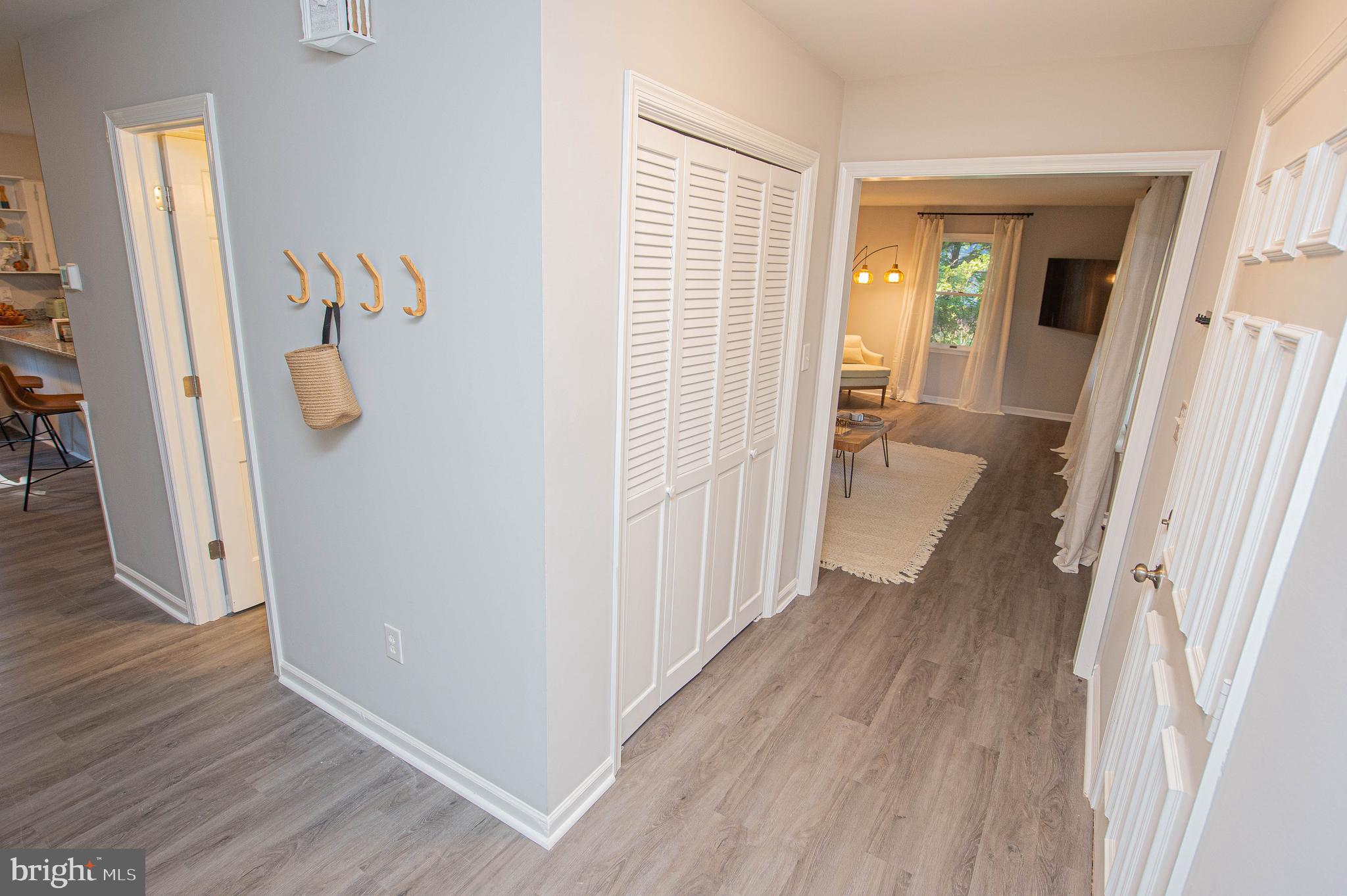 414 Pine Bluff Road Salisbury, MD 21801 - Photo 52 of 91 a view of a hallway with wooden floor and stairs