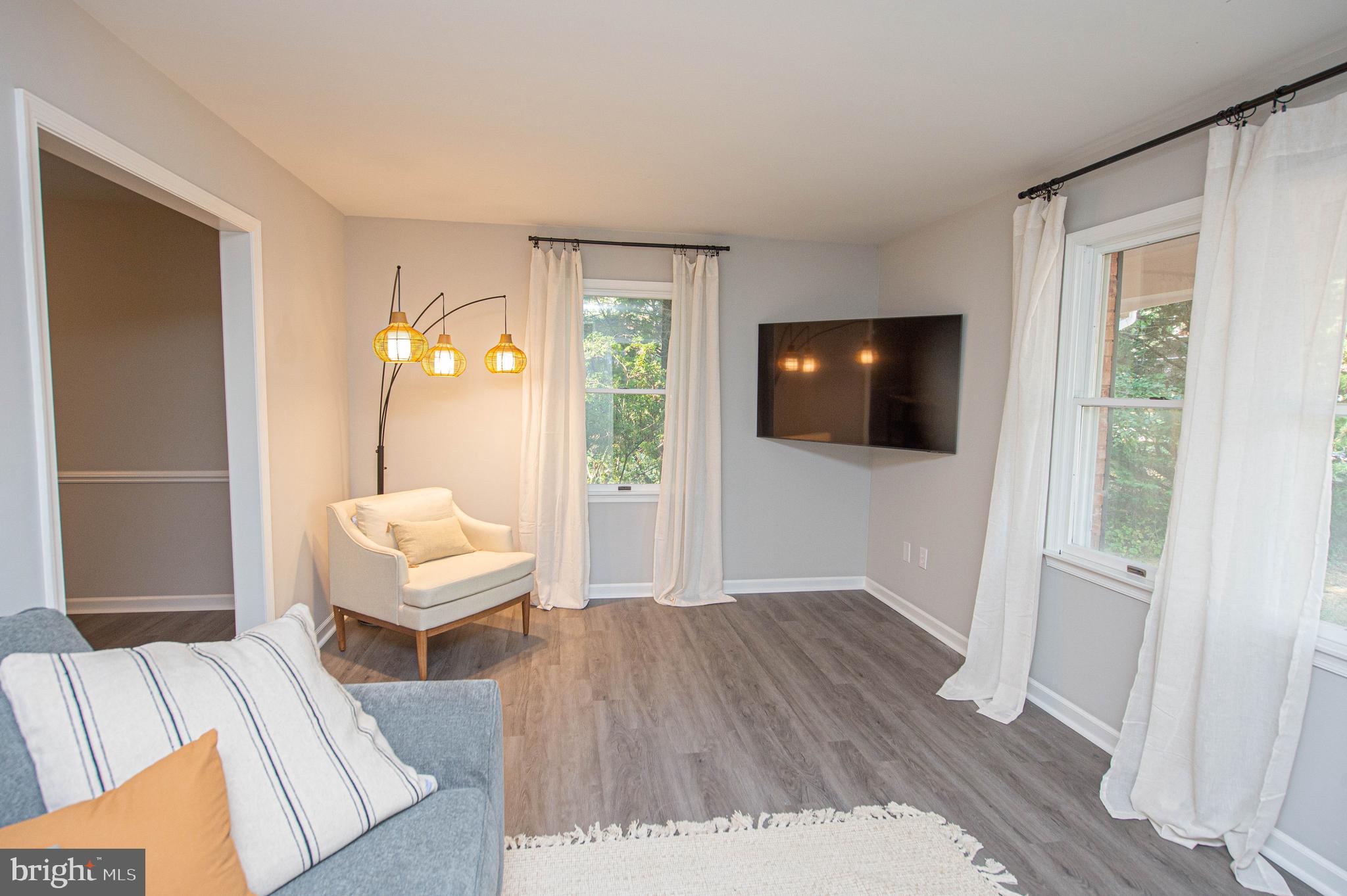 414 Pine Bluff Road Salisbury, MD 21801 - Photo 54 of 91 a living room with a bed furniture and a flat screen tv