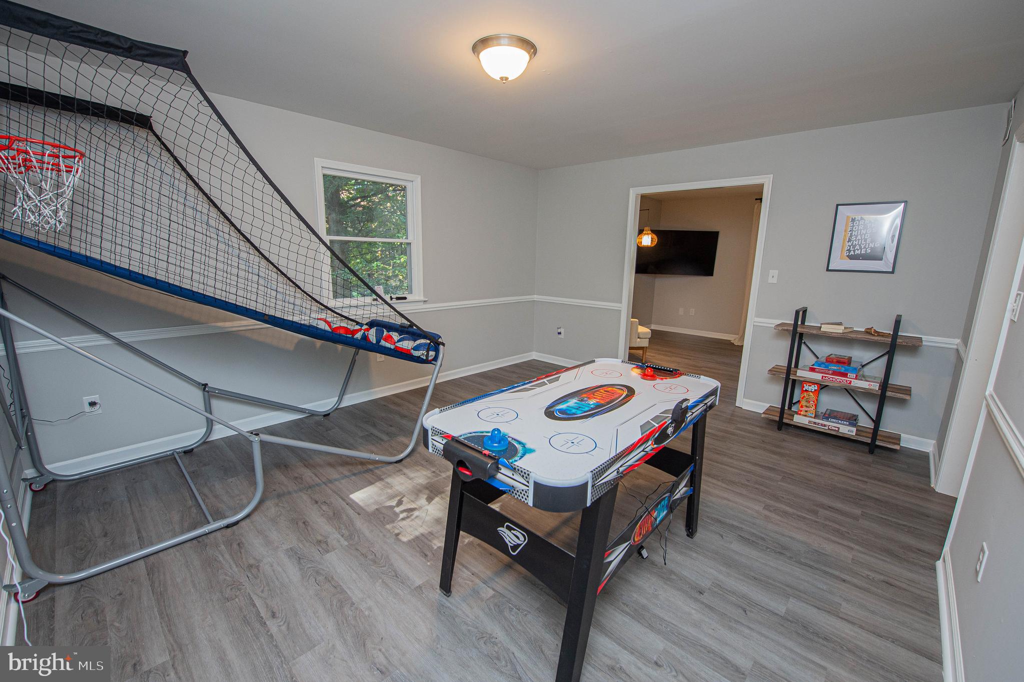 414 Pine Bluff Road Salisbury, MD 21801 - Photo 60 of 91 a living room with a table chairs and a wooden floor