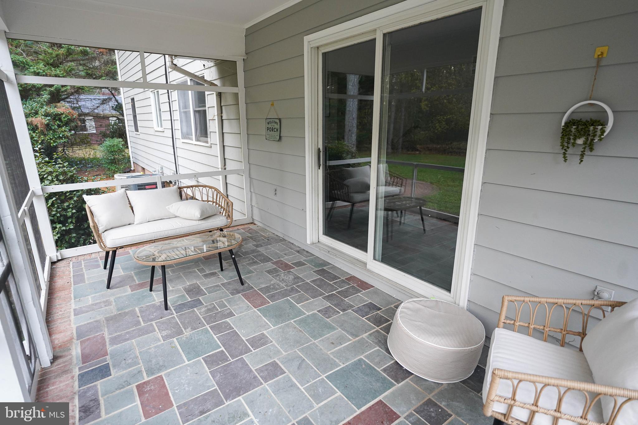 414 Pine Bluff Road Salisbury, MD 21801 - Photo 9 of 91 a living room with a black white checkered floor with a dining table and chair