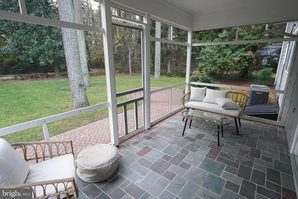 a view of front door of house with stairs