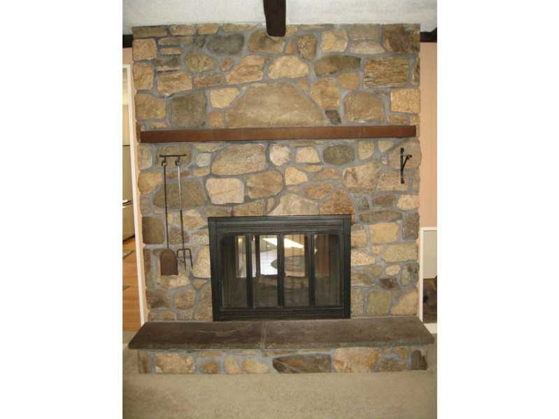1495 Chopmist Hill Road Scituate, RI 02857 - Photo 7 of 25 Living Room. Beautiful stone fireplace!