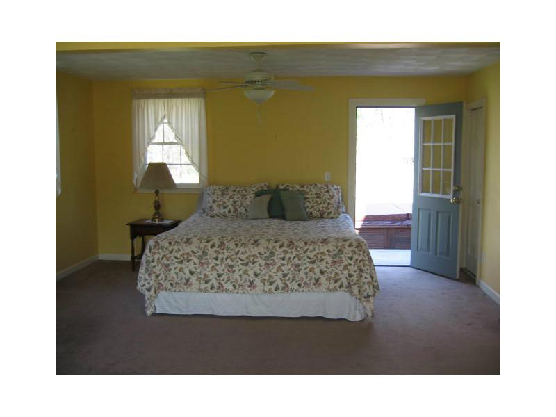1495 Chopmist Hill Road Scituate, RI 02857 - Photo 8 of 25 Master Bedroom. Huge master suite area that leads out to deck and hot tub!