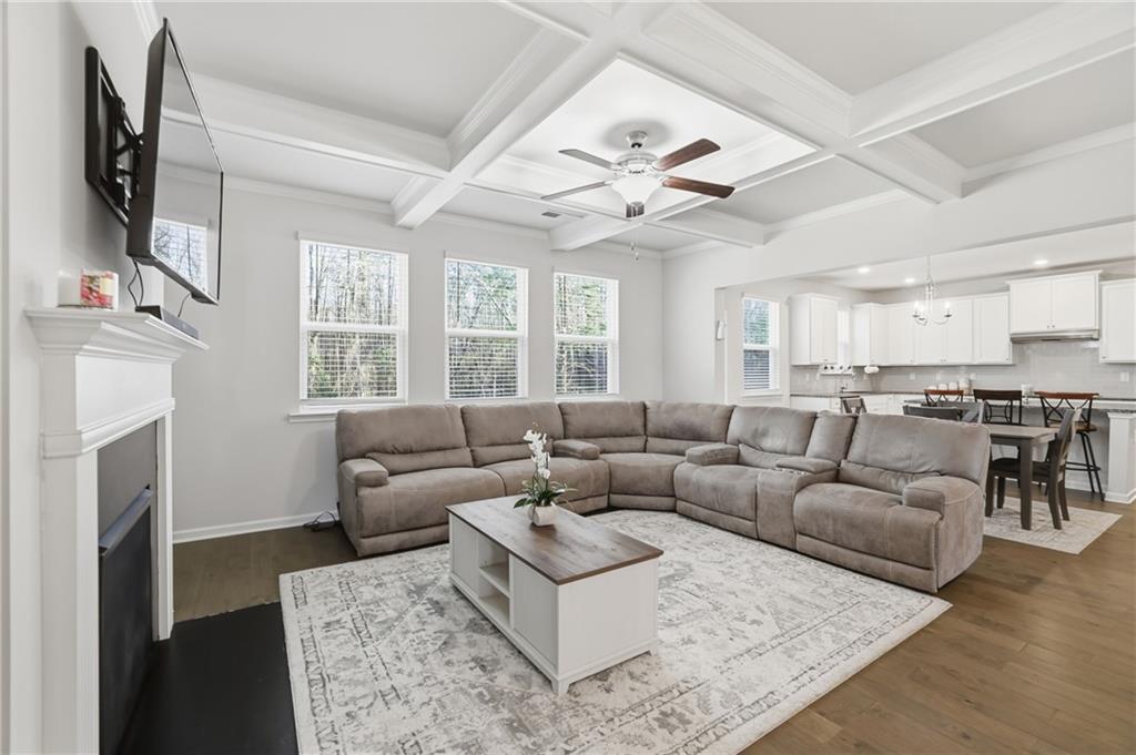 175 Paxton Lane Jefferson, GA 30549 - Photo 6 of 39 a living room with furniture a fireplace and a flat screen tv
