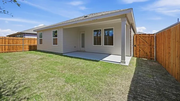 a view of a backyard of the house