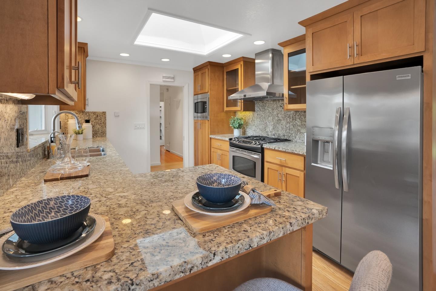 830 Cherrystone Drive Los Gatos, CA 95032 - Photo 13 of 28 a kitchen with stainless steel appliances granite countertop a sink refrigerator and stove