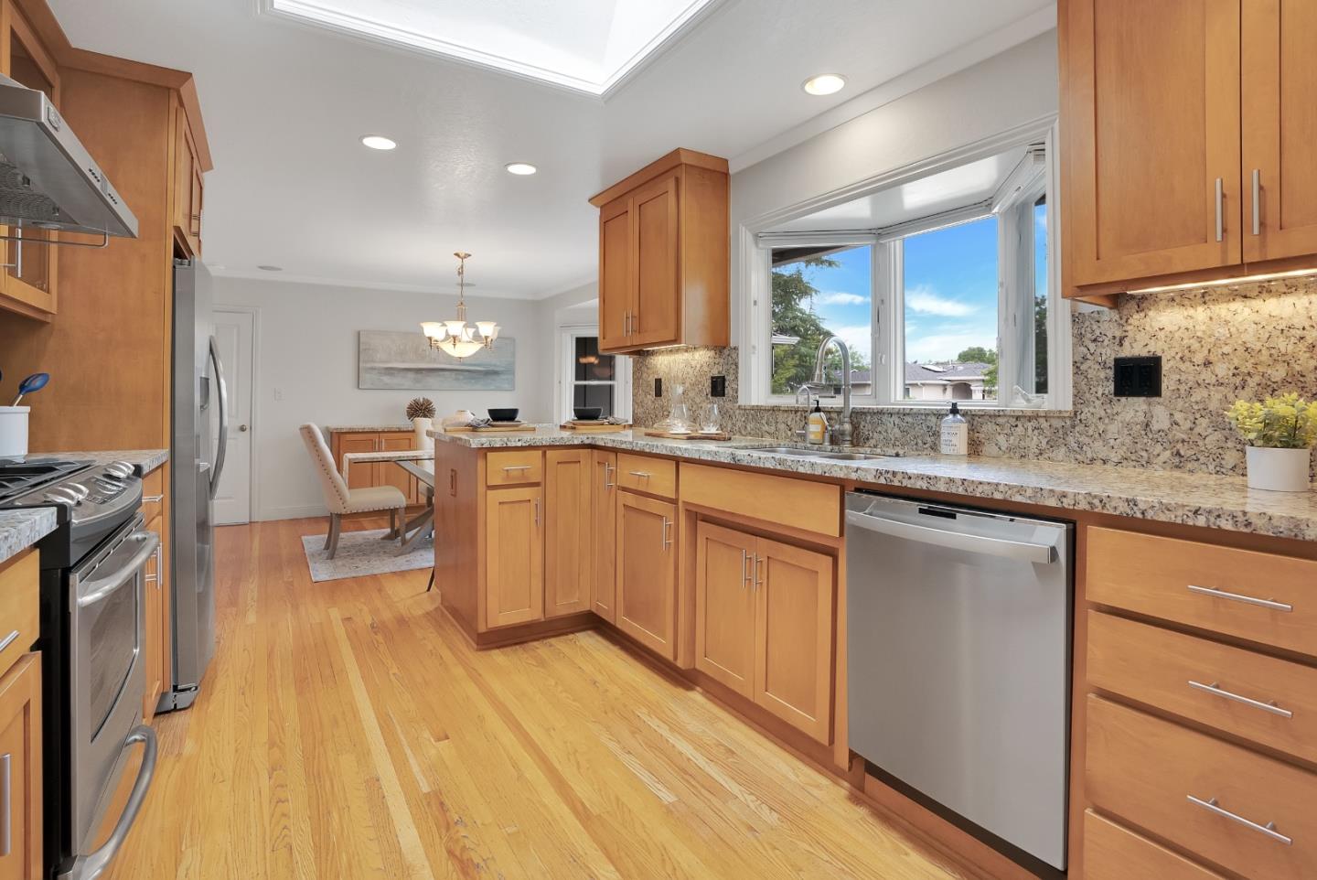 830 Cherrystone Drive Los Gatos, CA 95032 - Photo 14 of 28 a kitchen with a sink stove and cabinets