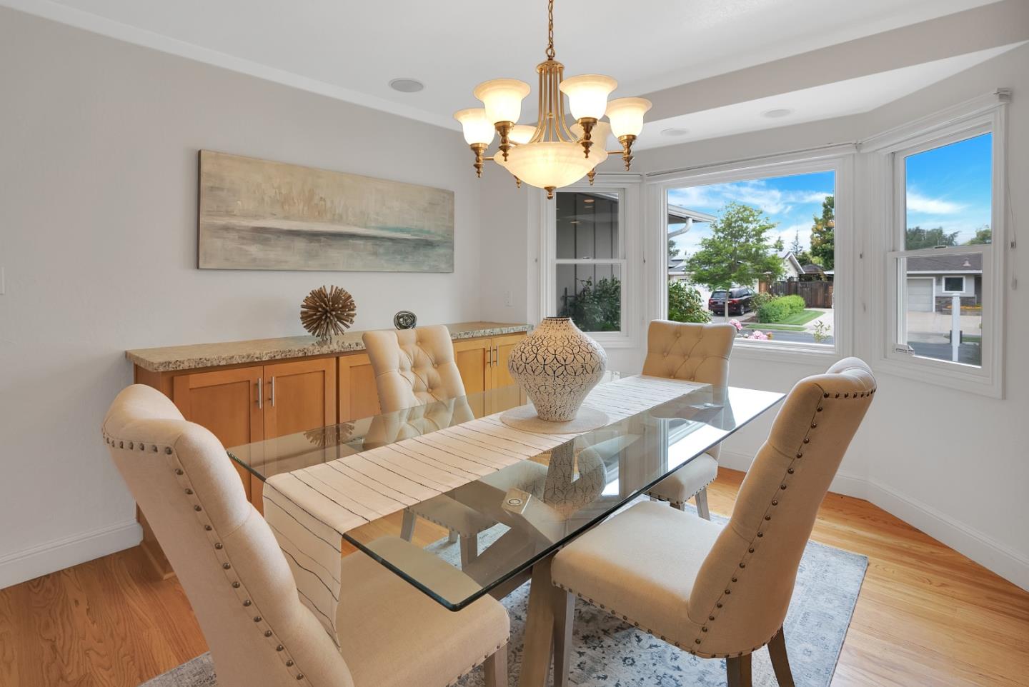 830 Cherrystone Drive Los Gatos, CA 95032 - Photo 16 of 28 a view of a dining room with furniture a chandelier and wooden floor