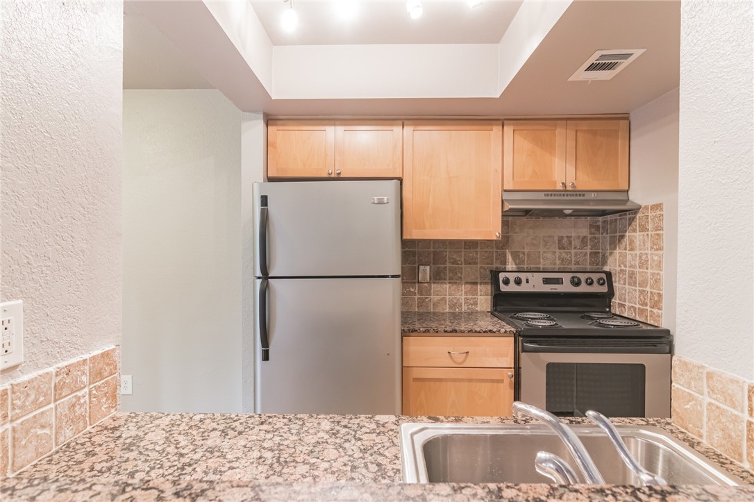 3627 Menchaca Road, Unit 112 Austin, TX 78704 - Photo 11 of 25 Kitchen taken from breakfast bar pass through.