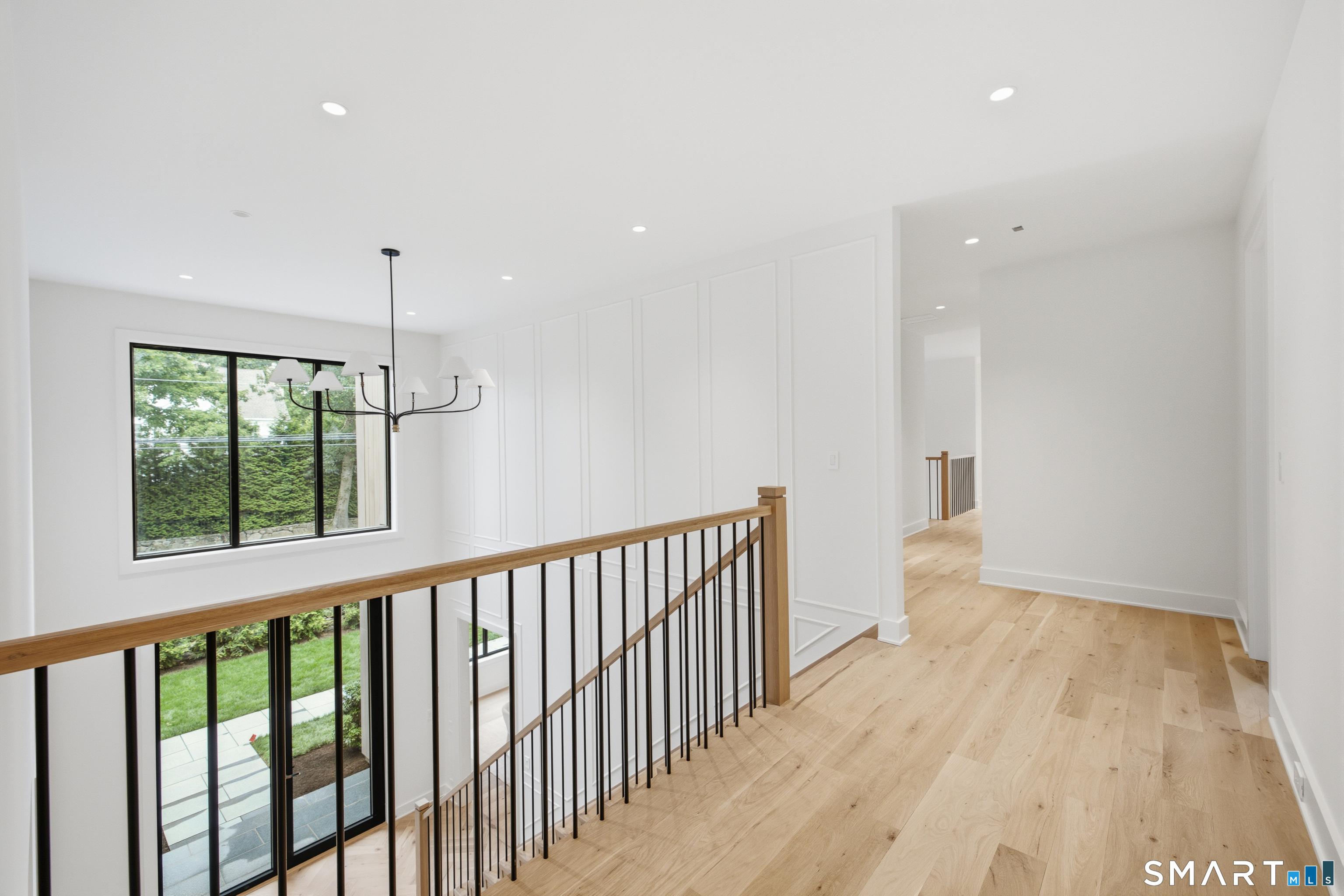2 Windy Hill Road Westport, CT 06880 - Photo 24 of 40 a view of a hallway with wooden floor and a window