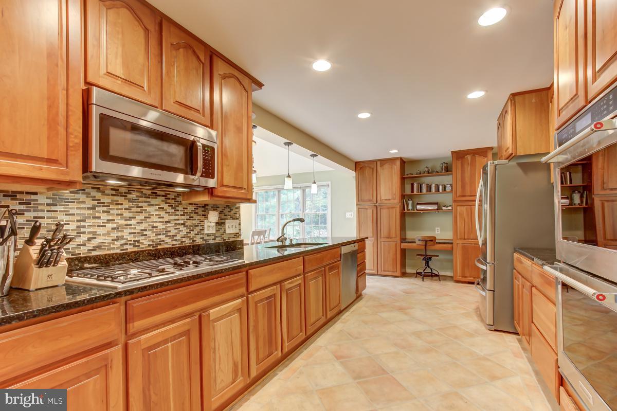 1808 Post Oak Trail Reston, VA 20191 - Photo 11 of 51 Kitchen with Granite Counters & Tile Floor