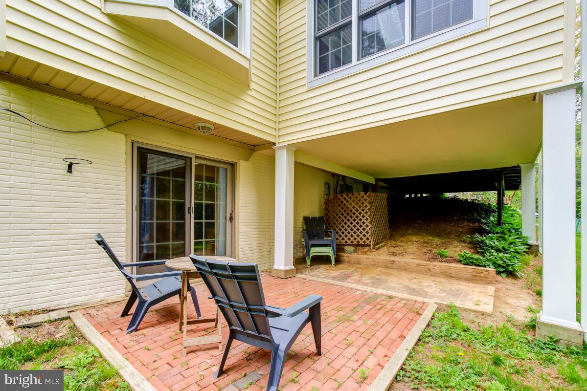 1808 Post Oak Trail Reston, VA 20191 - Photo 44 of 51 Backyard Patio off the Rec Room