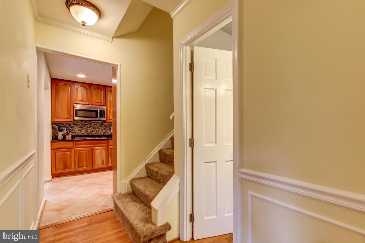 1808 Post Oak Trail Reston, VA 20191 - Photo 7 of 51 View from Foyer to Powder Room & Kitchen