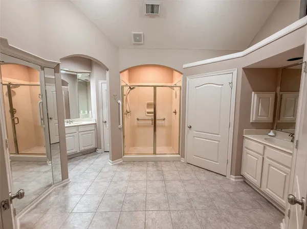 a view of a hallway with a bathroom