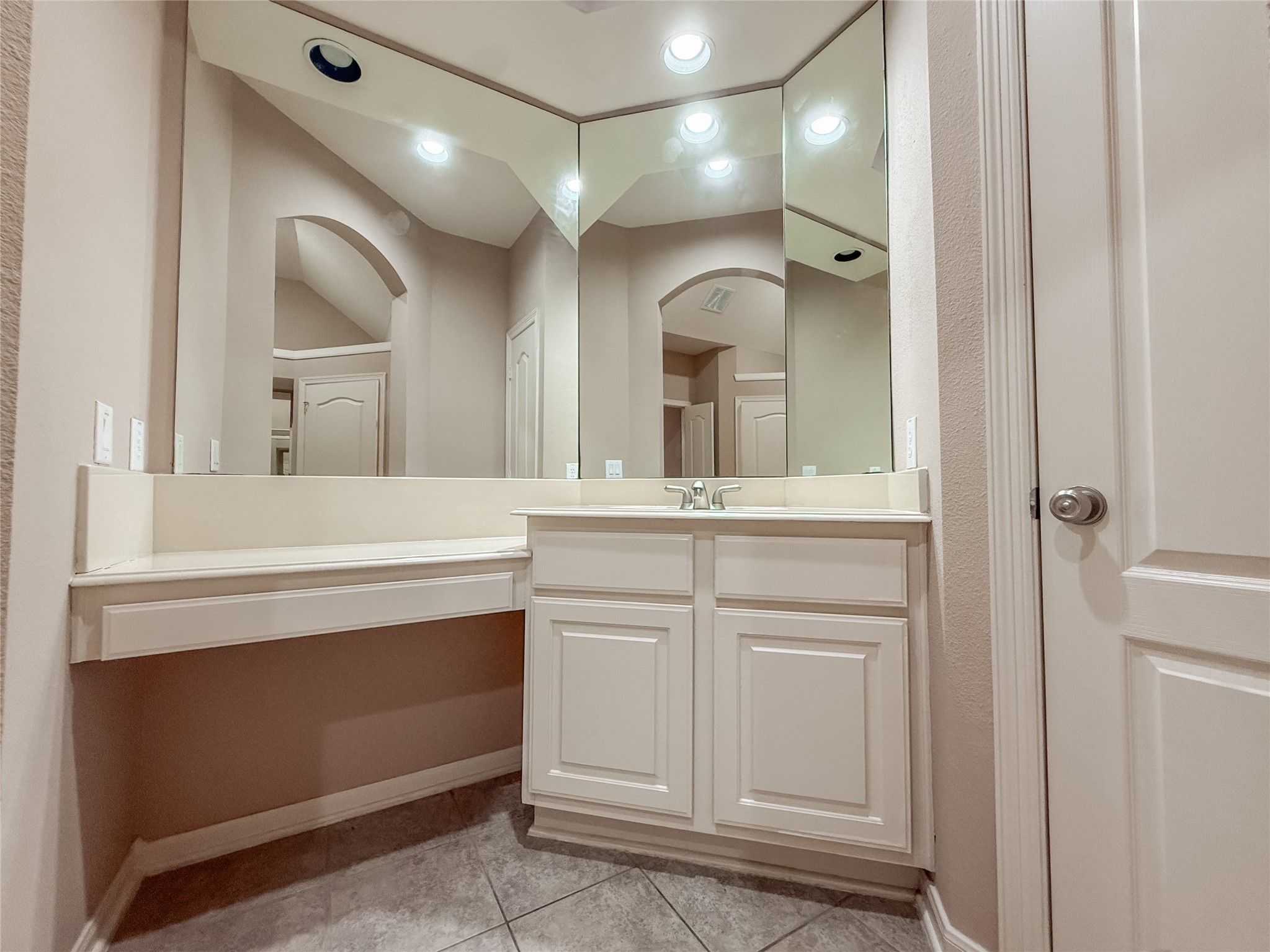 2426 Clippers Square Houston, TX 77058 - Photo 20 of 34 a bathroom with a sink a vanity and a mirror