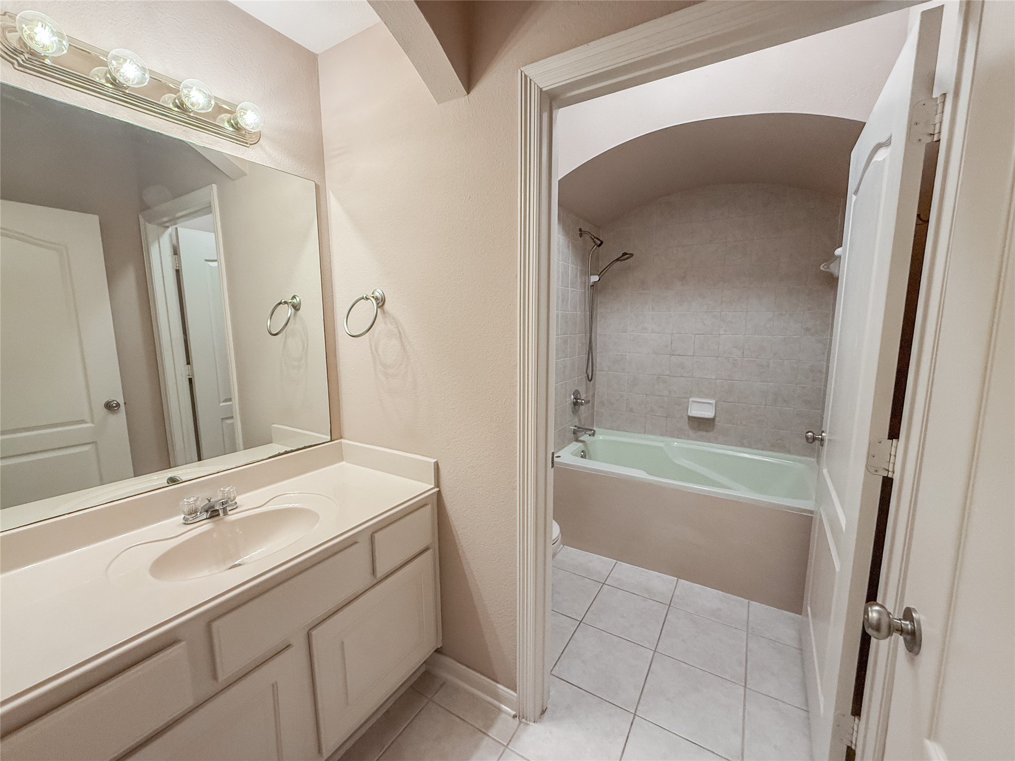 2426 Clippers Square Houston, TX 77058 - Photo 27 of 34 a bathroom with a tub sink and mirror