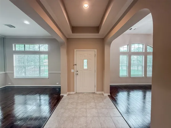 a view of a hallway with a window