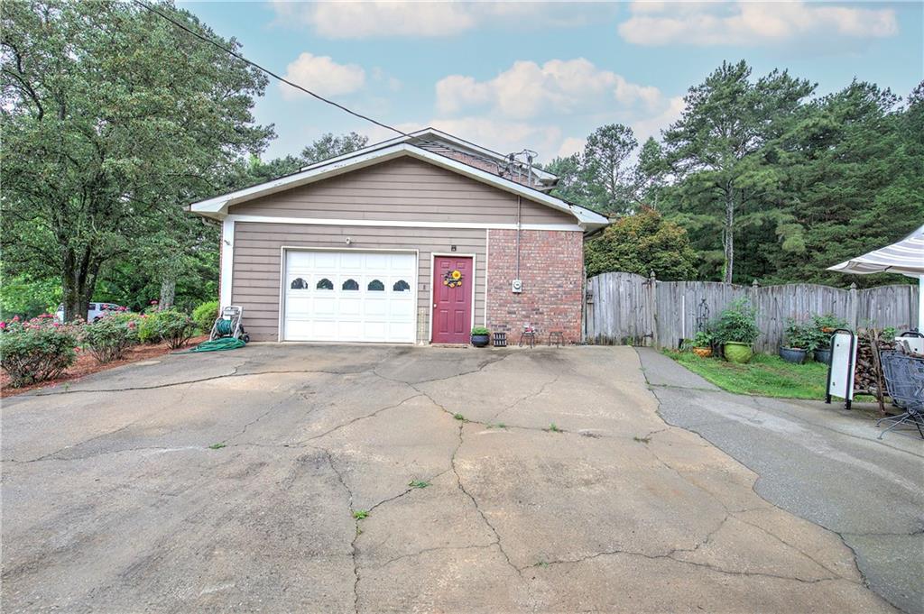 3637 Nebo Road Hiram, GA 30141 - Photo 8 of 63 a view of garage and yard