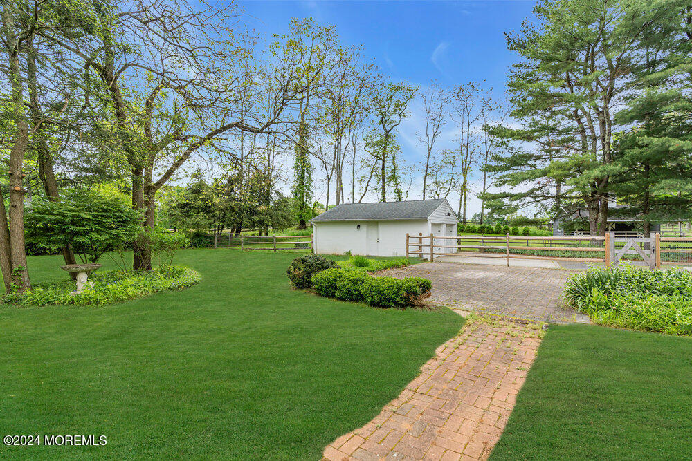 57 Creamery Road Colts Neck, NJ 07722 - Photo 25 of 35 a view of a house with garden and a tree
