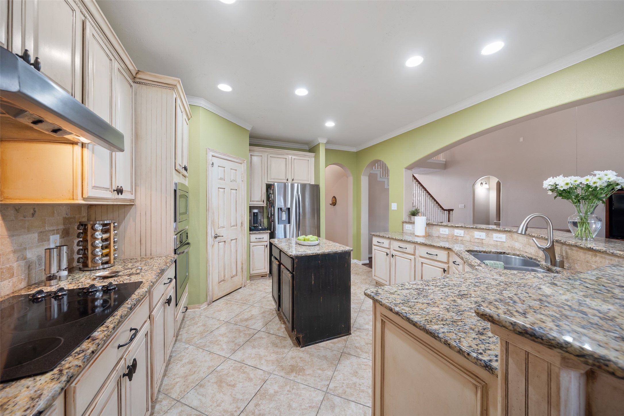 6407 Ashley Manor Drive Spring, TX 77389 - Photo 15 of 41 a kitchen with a sink and a refrigerator