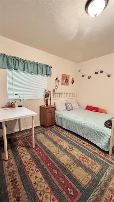 680 Choctaw Quitman, TX 75783 - Photo 11 of 33 a bedroom with a bed table and chair