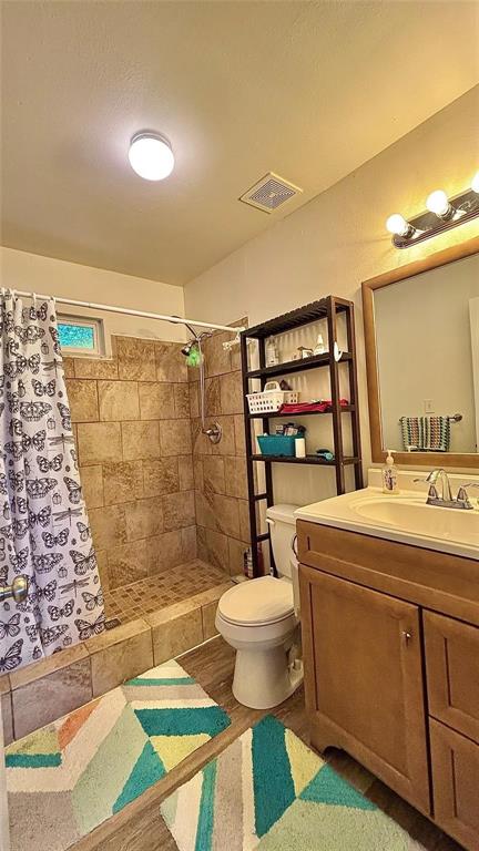 680 Choctaw Quitman, TX 75783 - Photo 13 of 33 a bathroom with a sink toilet and shower