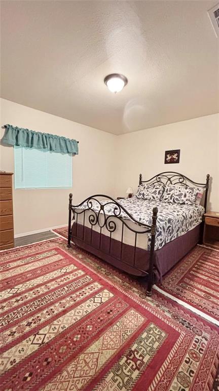 680 Choctaw Quitman, TX 75783 - Photo 16 of 33 a bedroom with a bed and a window