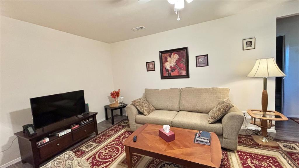 680 Choctaw Quitman, TX 75783 - Photo 8 of 33 a living room with furniture and a flat screen tv