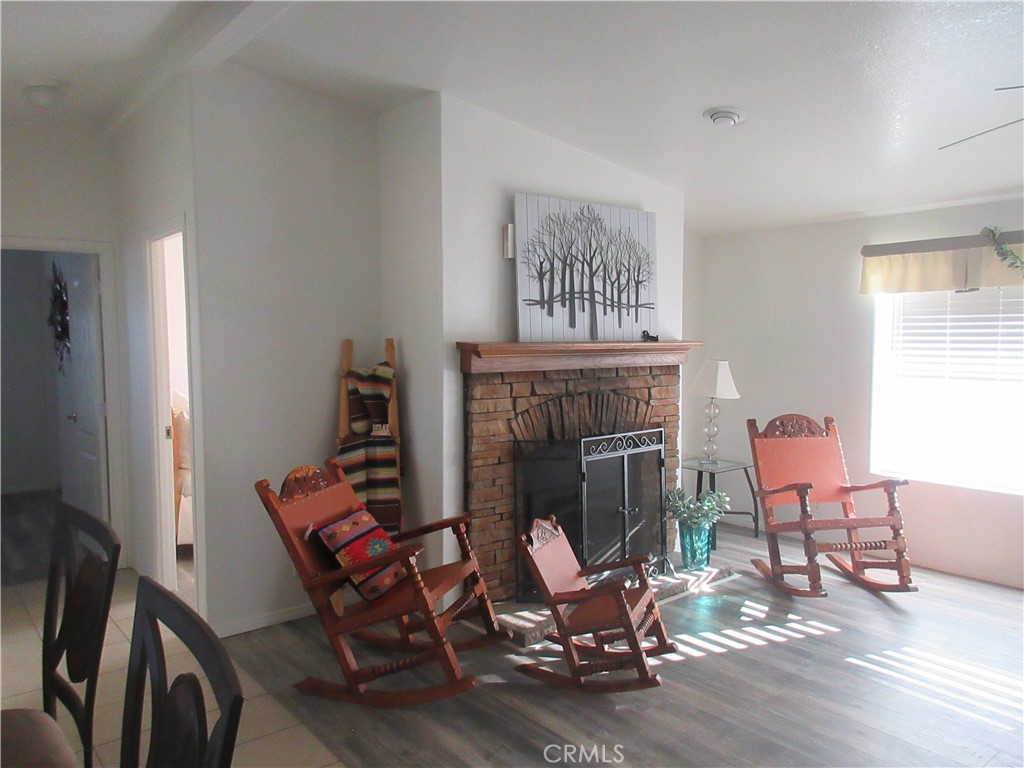 Undisclosed Address Phelan, CA 92371 - Photo 11 of 42 a living room with furniture and a fireplace
