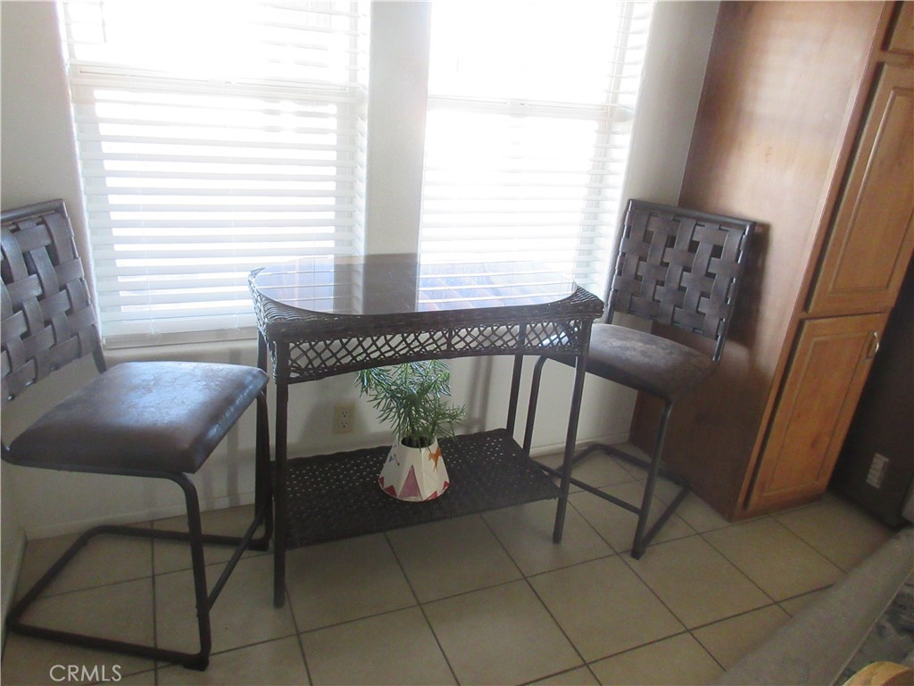 Undisclosed Address Phelan, CA 92371 - Photo 17 of 42 a view of a dining room with furniture and window