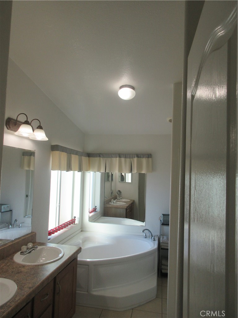 Undisclosed Address Phelan, CA 92371 - Photo 19 of 42 a room with a bed and a table