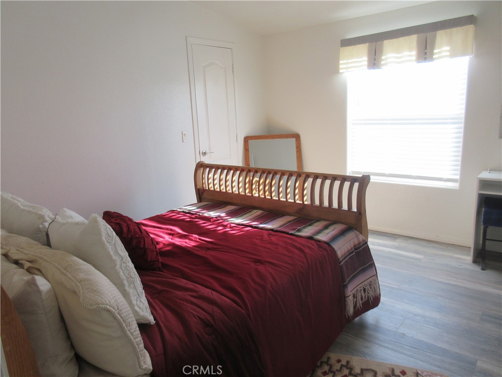 Undisclosed Address Phelan, CA 92371 - Photo 33 of 42 a bedroom with a bed and window