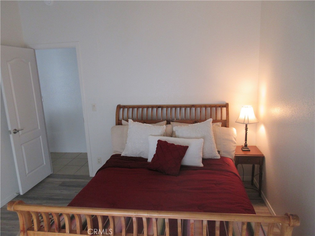 Undisclosed Address Phelan, CA 92371 - Photo 36 of 42 a large bed sitting in a bedroom next to a bathroom