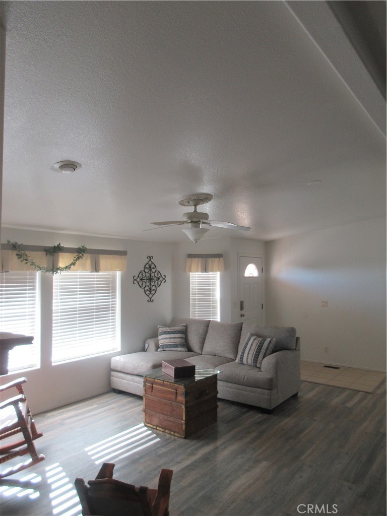 Undisclosed Address Phelan, CA 92371 - Photo 37 of 42 a living room with furniture and a large window