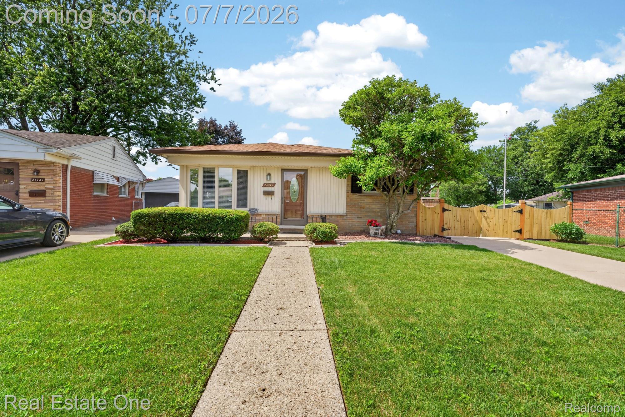 24749 Munson Street Taylor, MI 48180 - Photo 2 of 28 Ranch-style exterior with a light-colored facade and brick accents