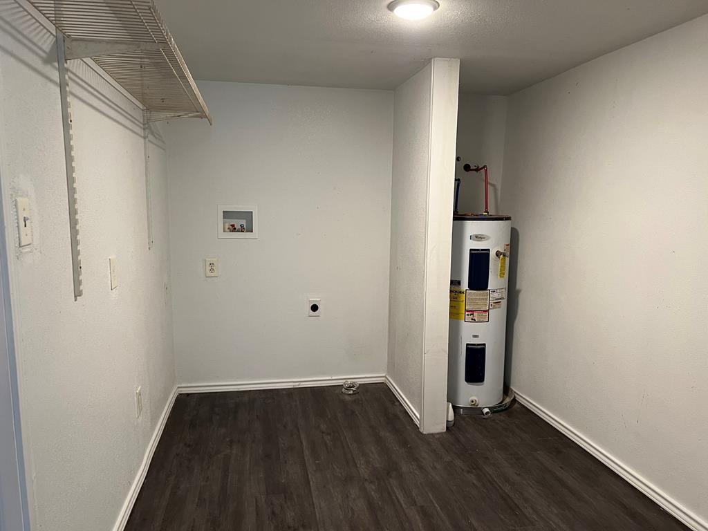 124 Griffith Bend Road Mabank, TX 75156 - Photo 14 of 15 a view of an empty room with wooden floor and a window