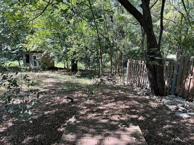 a view of backyard with green space