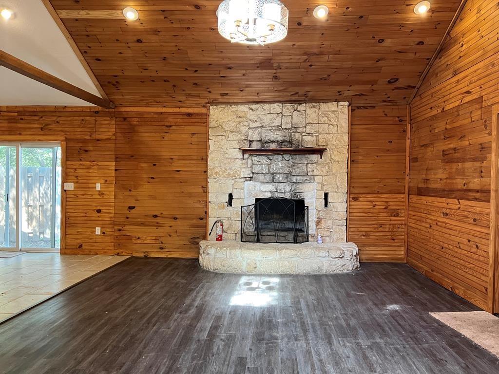 124 Griffith Bend Road Mabank, TX 75156 - Photo 3 of 15 a view of empty room with wooden floor and fireplace