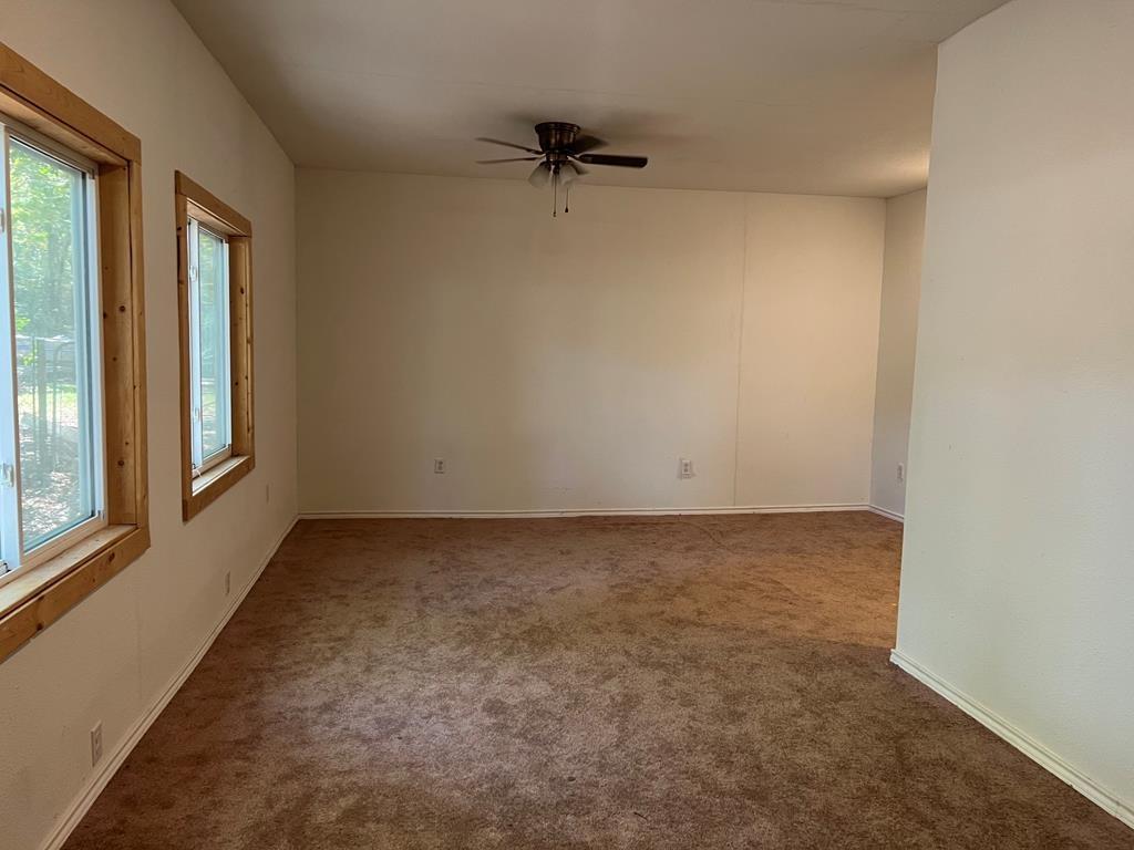 124 Griffith Bend Road Mabank, TX 75156 - Photo 7 of 15 a view of an empty room and a window