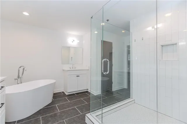 a bathroom with a shower and a sink
