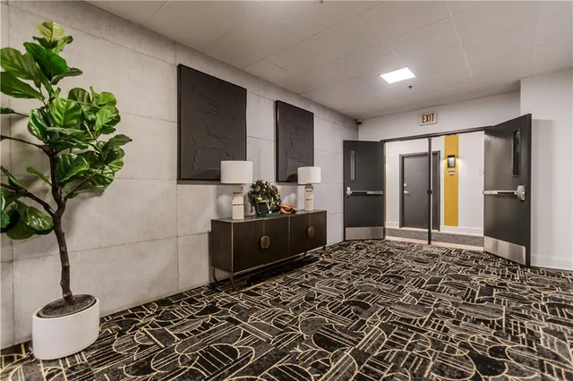 a view of an empty room with glass door