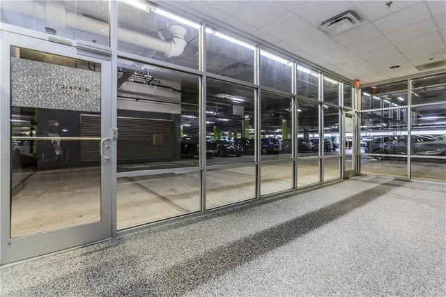 a view of parking garage with cars