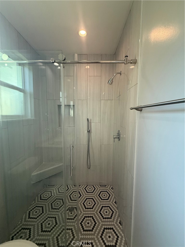 6504 Hesperia Avenue Reseda, CA 91335 - Photo 4 of 11 a bathroom with a shower and a sink