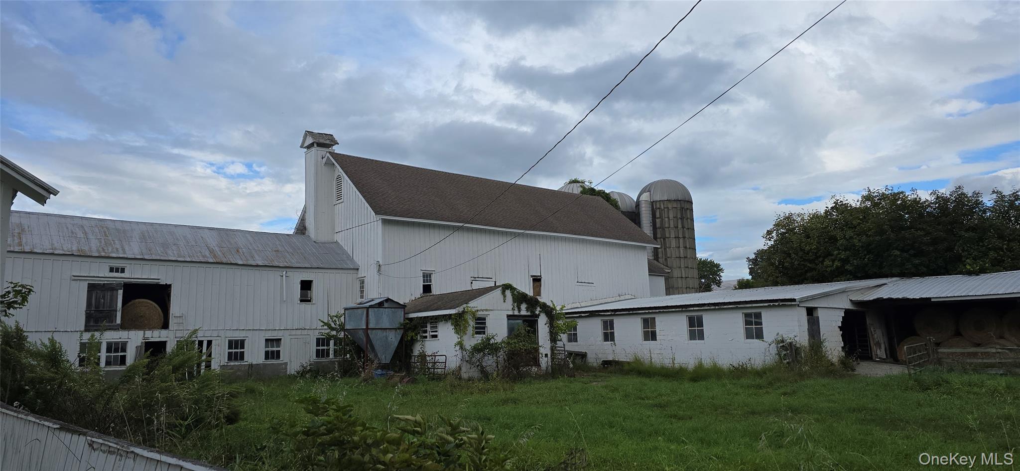 1198 82nd Route Hopewell Junction, NY 12533 - Photo 11 of 17 Rear view of house featuring a chimney