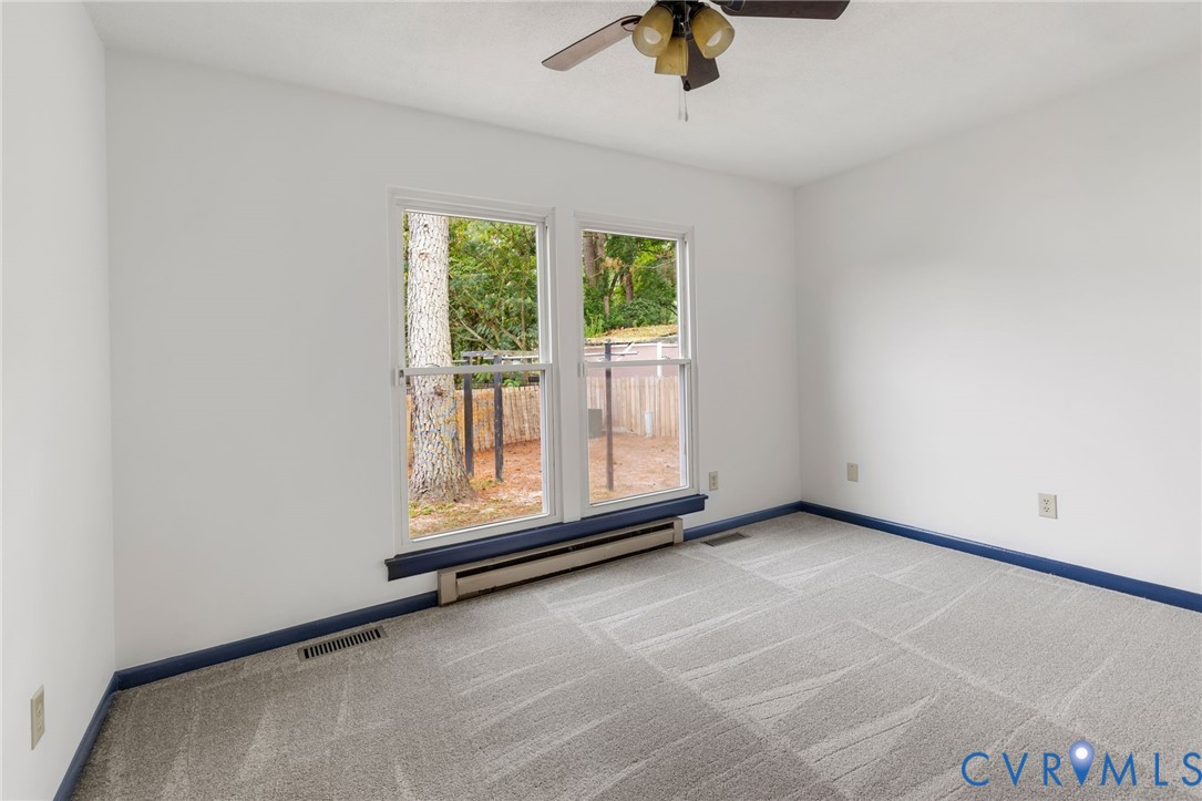 15908 Tri Gate Road Chester, VA 23831 - Photo 18 of 28 a view of an empty room with a window