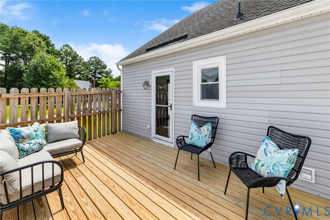 15908 Tri Gate Road Chester, VA 23831 - Photo 22 of 28 a view of a chairs on the deck