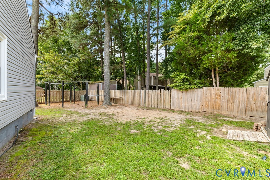 15908 Tri Gate Road Chester, VA 23831 - Photo 24 of 28 a view of a back yard